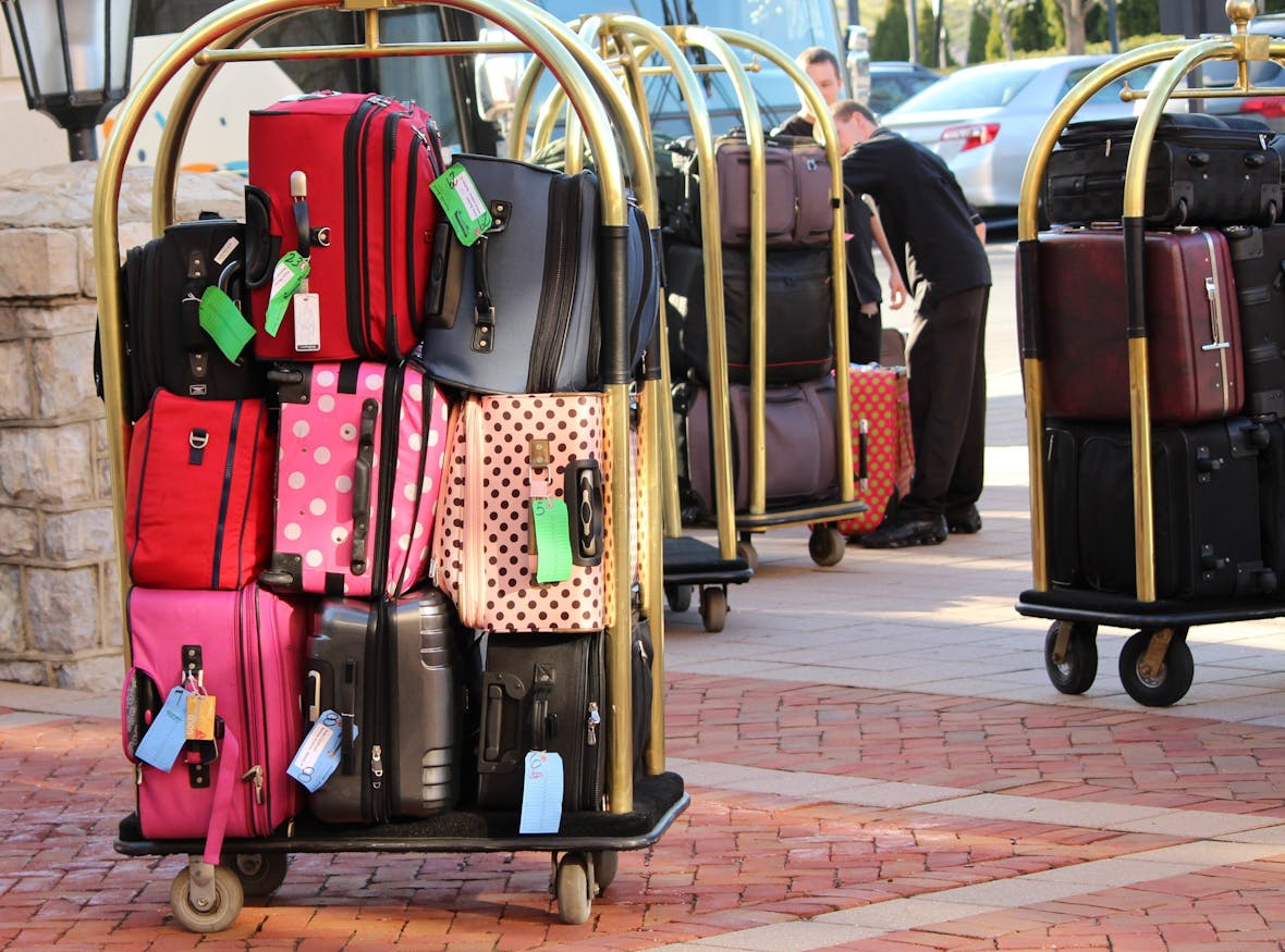 Tourists go shopping with suitcases to stock up on luxury items